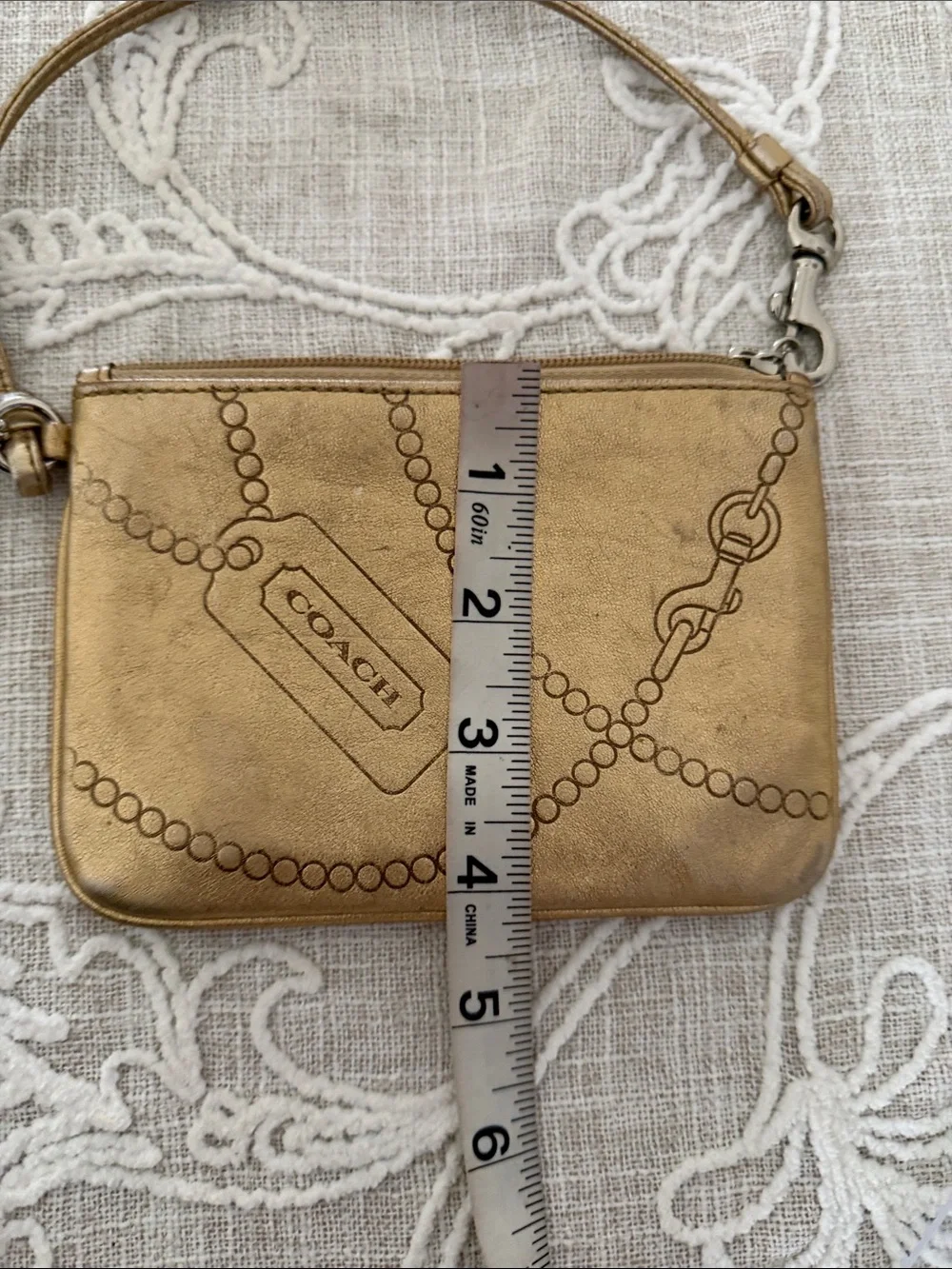 Coach Metallic Gold Wristlet with Embossed Chain Motif